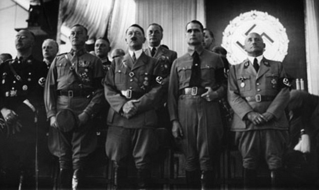 Dictator and monster: Hitler, pictured centred, with fellow Nazi leaders pictured at the party's spiritual home in Nuremburg, Germany